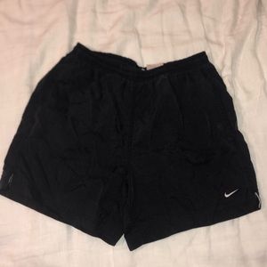 Black Nike running shorts